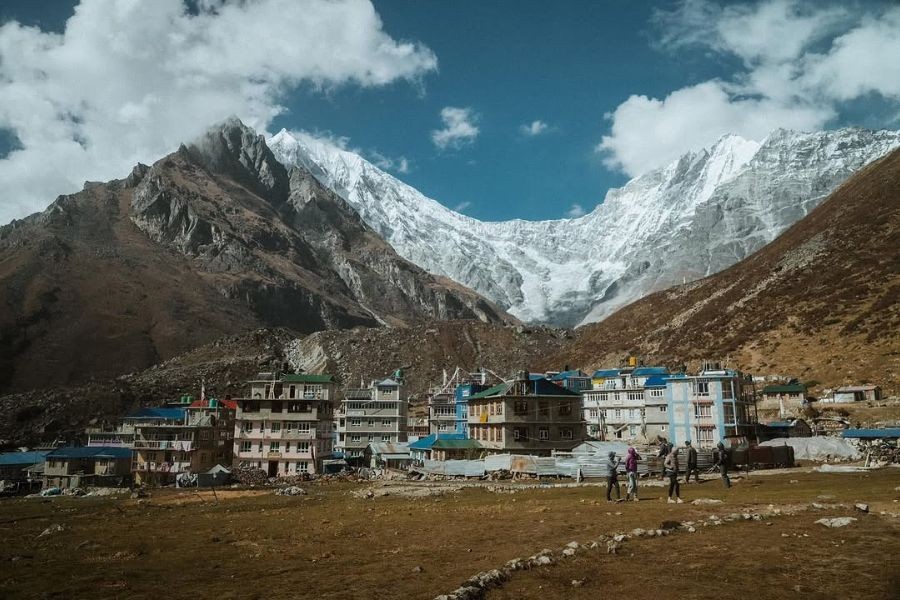 Langtang village lodges beneath dramatic glacier and snow peaks